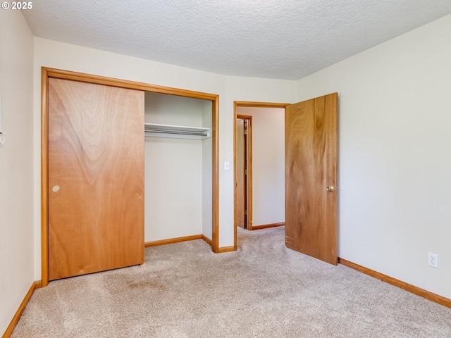7804 NW 1st Ave, Vancouver, WA 98665 - unfurnished bedroom featuring carpet flooring, a closet, and a textured ceiling