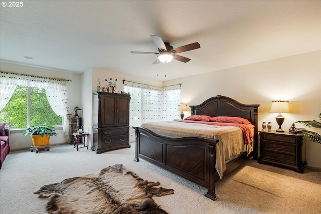 17544 SW Keystone Ct, Beaverton, OR 97007 - bedroom featuring light colored carpet, a ceiling fan, and baseboards