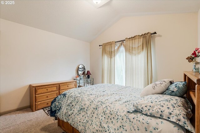 17544 SW Keystone Ct, Beaverton, OR 97007 - bedroom with light colored carpet, lofted ceiling, and baseboards