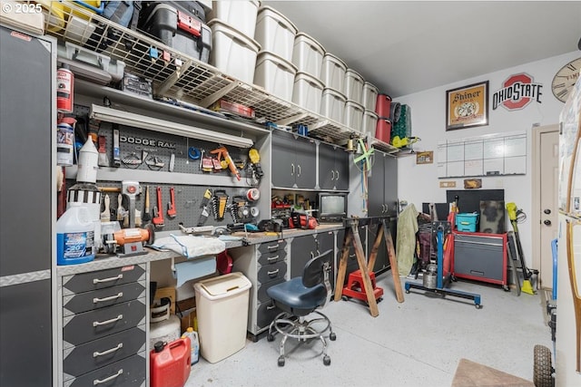 17544 SW Keystone Ct, Beaverton, OR 97007 - miscellaneous room featuring a workshop area and speckle patterned floor