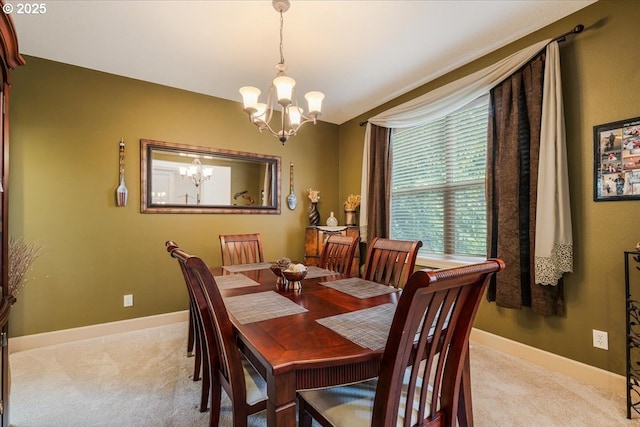17544 SW Keystone Ct, Beaverton, OR 97007 - dining area with a chandelier, light carpet, and baseboards
