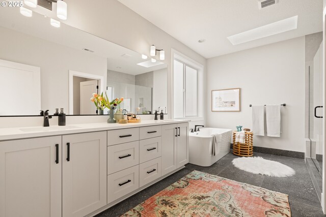 2901 NW 114th Ter, Portland, OR 97229 - bathroom featuring granite floors, double vanity, a stall shower, a freestanding bath, and a skylight