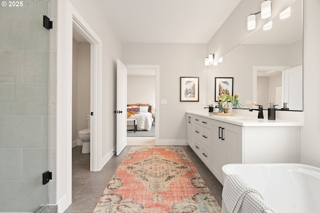 2901 NW 114th Ter, Portland, OR 97229 - full bathroom featuring double vanity, a stall shower, toilet, connected bathroom, and baseboards