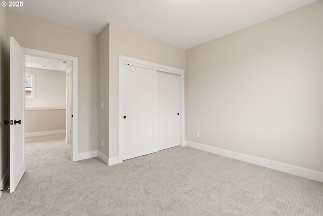 2901 NW 114th Ter, Portland, OR 97229 - unfurnished bedroom with light colored carpet, a closet, and baseboards