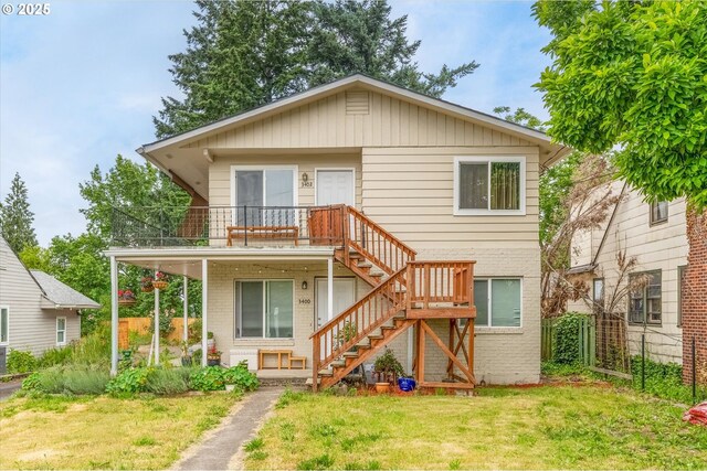 3400 E 13th St, Vancouver, WA 98661 - rear view of property with stairway, brick siding, and a deck