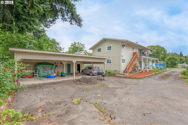3400 E 13th St, Vancouver, WA 98661 - view of home's exterior with stairway, a carport, and driveway