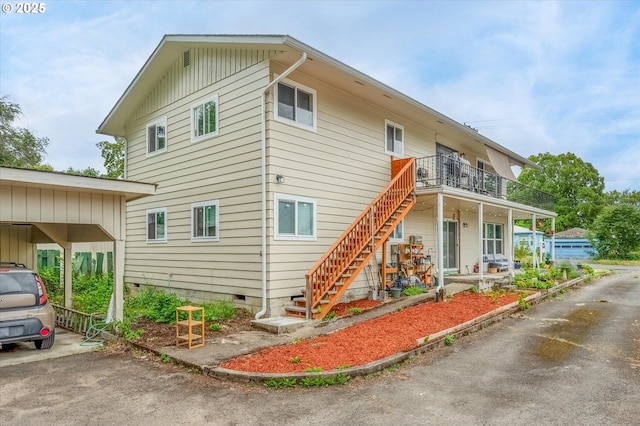 3400 E 13th St, Vancouver, WA 98661 - view of side of property with stairway, crawl space, and a carport