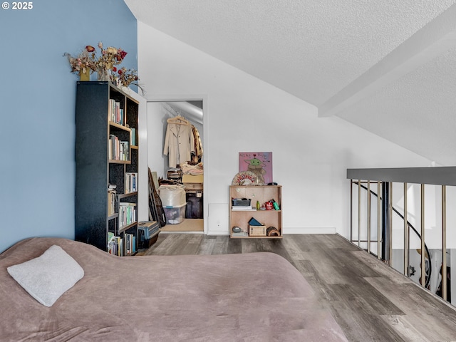 346 NE Skipanon Dr Unit 46, Warrenton, OR 97146 - bedroom with wood finished floors and a textured ceiling