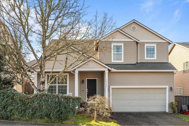 13765 SW Florentine Ave, Portland, OR 97223 - traditional-style home with roof with shingles, driveway, and a garage
