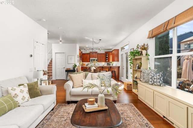 13765 SW Florentine Ave, Portland, OR 97223 - living area featuring dark wood-style floors and stairs