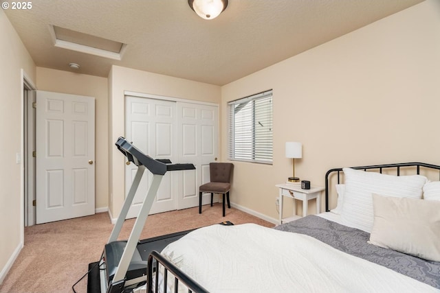 13765 SW Florentine Ave, Portland, OR 97223 - carpeted bedroom featuring attic access, baseboards, a closet, and a textured ceiling