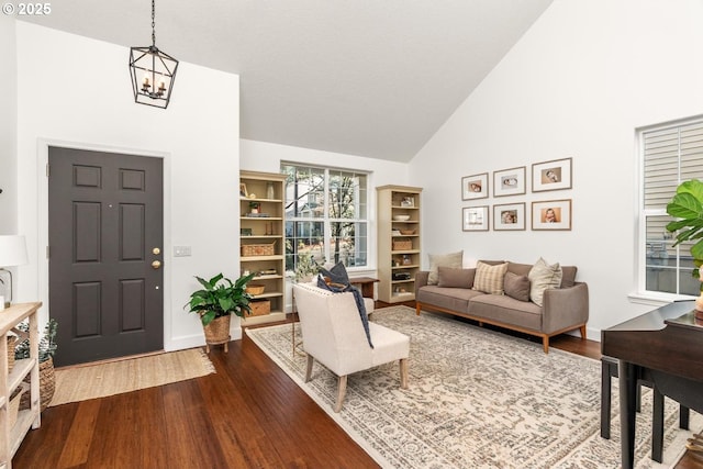 13765 SW Florentine Ave, Portland, OR 97223 - living area with dark wood-type flooring, a chandelier, and high vaulted ceiling