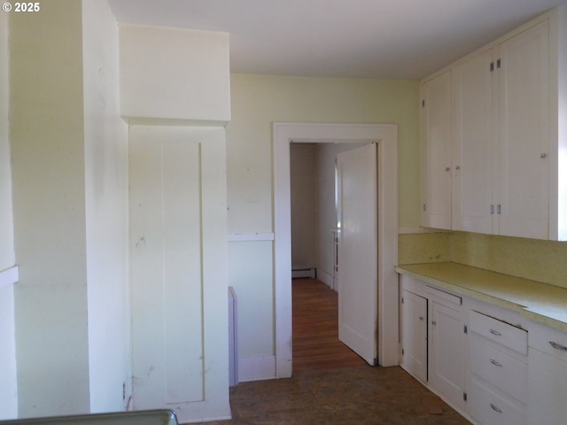 84105 Winesap Rd, Milton-Freewater, OR 97862 - kitchen featuring white cabinetry, a baseboard radiator, dark wood-style floors, and light countertops