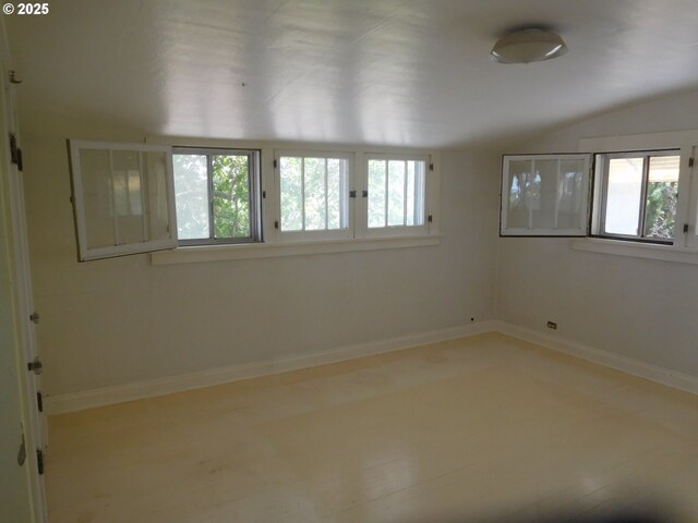 84105 Winesap Rd, Milton-Freewater, OR 97862 - empty room with lofted ceiling and baseboards