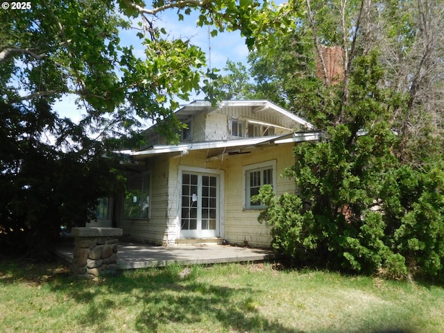 84105 Winesap Rd, Milton-Freewater, OR 97862 - back of house with a patio, a lawn, and french doors