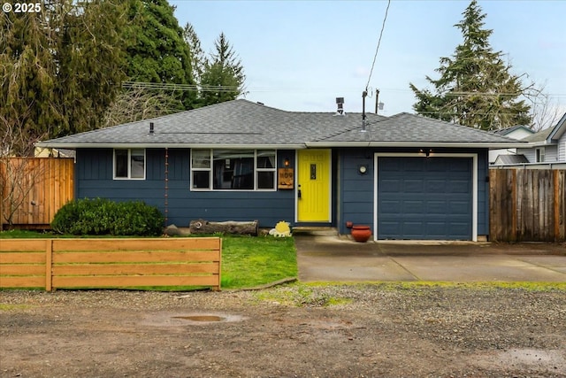 ranch-style home with driveway, a shingled roof, an attached garage, and fence