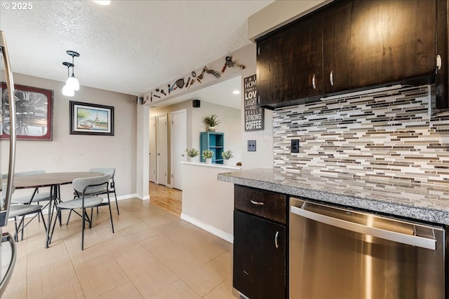 kitchen featuring a textured ceiling, dark brown cabinetry, pendant lighting, dishwasher, and tasteful backsplash