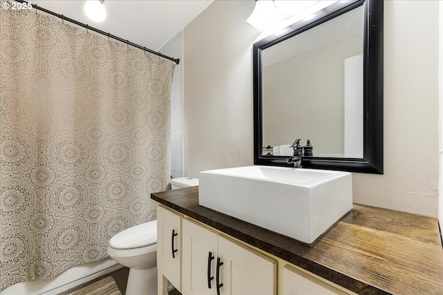 full bathroom featuring toilet and vanity