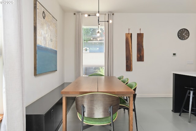 dining area featuring baseboards