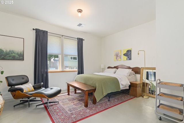 bedroom featuring concrete flooring and visible vents