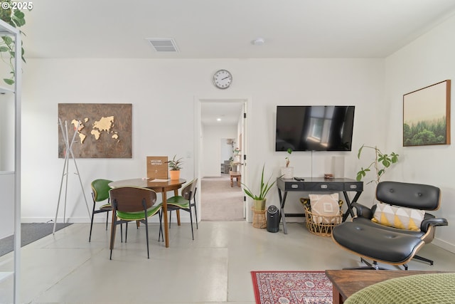 living room with visible vents and baseboards