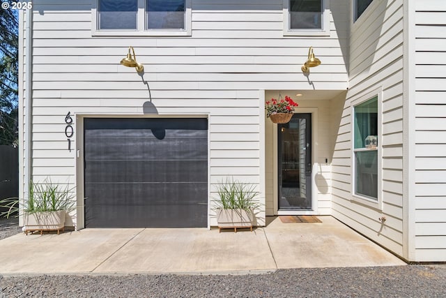 doorway to property featuring a garage