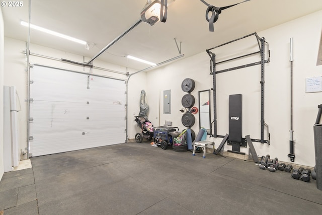 garage featuring a garage door opener and electric panel