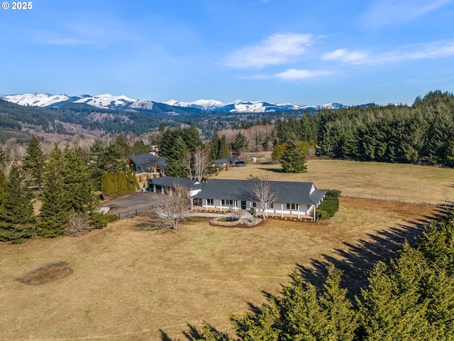 drone / aerial view featuring a mountain view