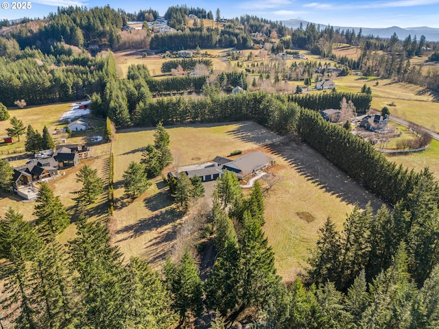 drone / aerial view featuring a rural view and a mountain view