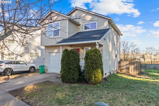 view of front of house with a garage and a front yard