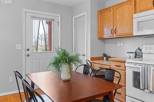 dining space featuring light hardwood / wood-style flooring