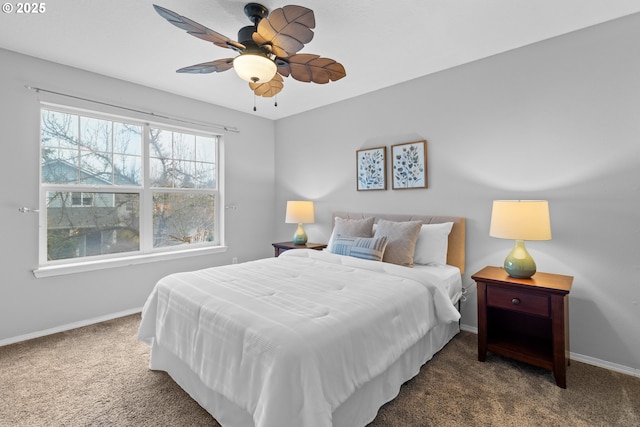 bedroom featuring ceiling fan and dark carpet