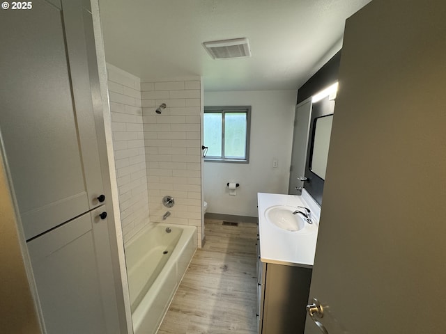 2420 Margery St, West Linn, OR 97068 - bathroom with toilet, vanity, wood finished floors, tub / shower combination, and baseboards