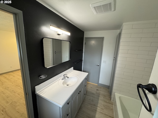 2420 Margery St, West Linn, OR 97068 - full bath featuring wood finished floors, vanity, and a bath