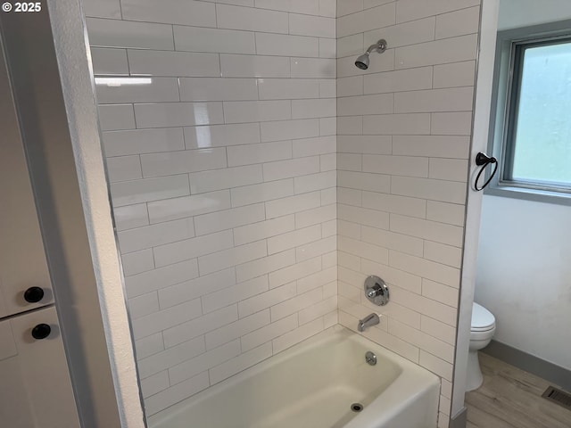 2420 Margery St, West Linn, OR 97068 - bathroom featuring toilet, wood finished floors, washtub / shower combination, and baseboards