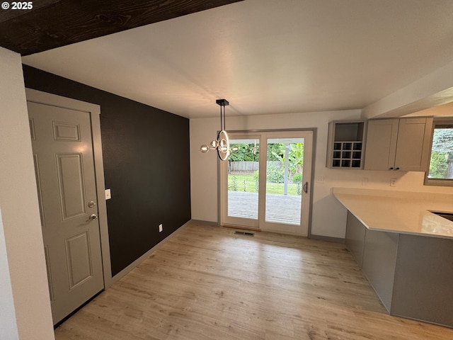 2420 Margery St, West Linn, OR 97068 - unfurnished dining area featuring light wood-style flooring and a chandelier