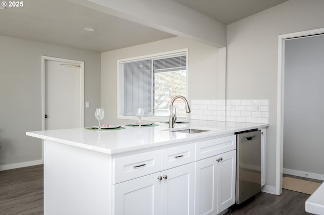 kitchen featuring light countertops, dark wood-type flooring, white cabinets, a sink, and dishwasher