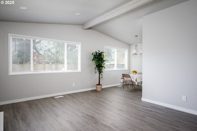 unfurnished room featuring vaulted ceiling with beams, an inviting chandelier, baseboards, and dark wood-type flooring