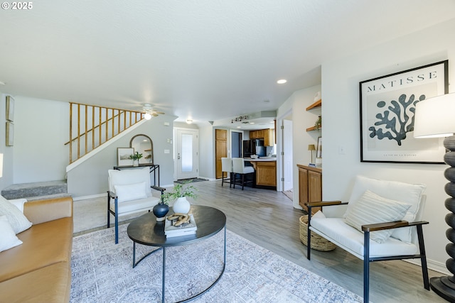 397 S 32nd St, Springfield, OR 97478 - living room featuring stairs, light wood-style floors, a ceiling fan, baseboards, and recessed lighting