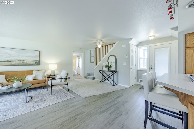 397 S 32nd St, Springfield, OR 97478 - living area with stairs, light wood-style floors, a ceiling fan, and baseboards