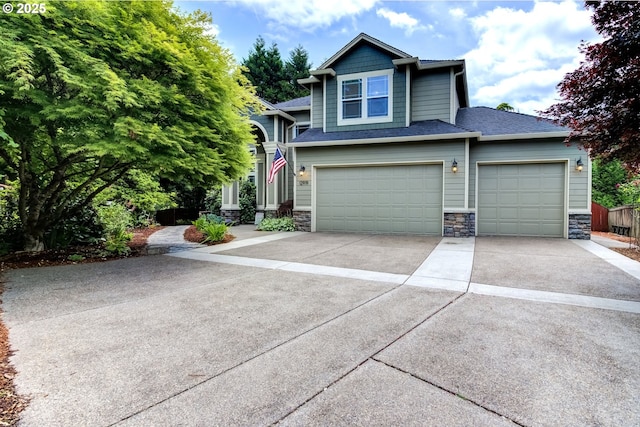 12919 NE 37th Ct, Vancouver, WA 98686 - view of front of property featuring stone siding, concrete driveway, and a garage
