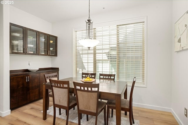 4891 NW Blandy Ter, Portland, OR 97229 - dining room with light wood finished floors, healthy amount of natural light, and baseboards