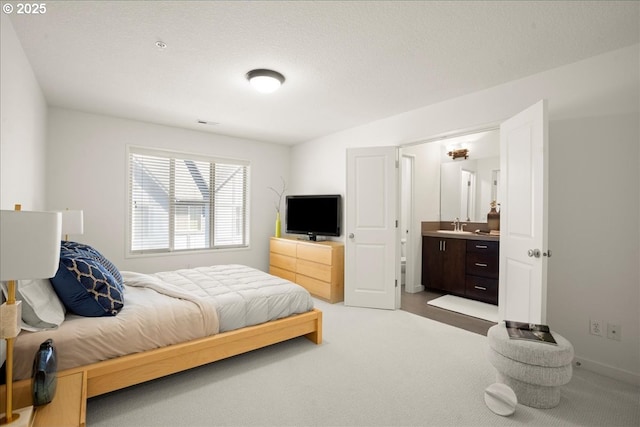 4891 NW Blandy Ter, Portland, OR 97229 - bedroom with carpet, ensuite bath, and a sink