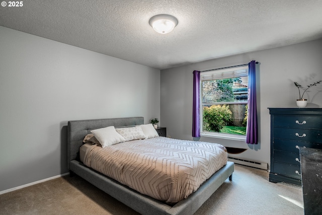 bedroom featuring light colored carpet, a textured ceiling, and a baseboard heating unit