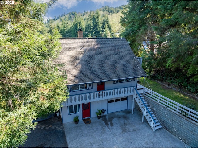 aerial view featuring a wooded view