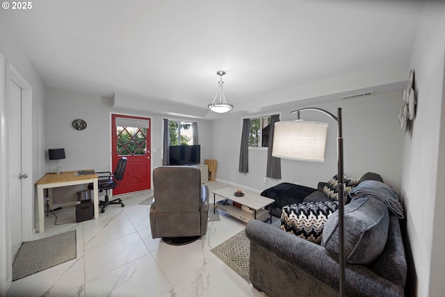 living room with visible vents and marble finish floor