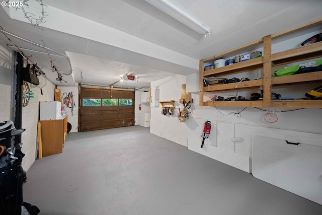 garage featuring electric panel and a garage door opener