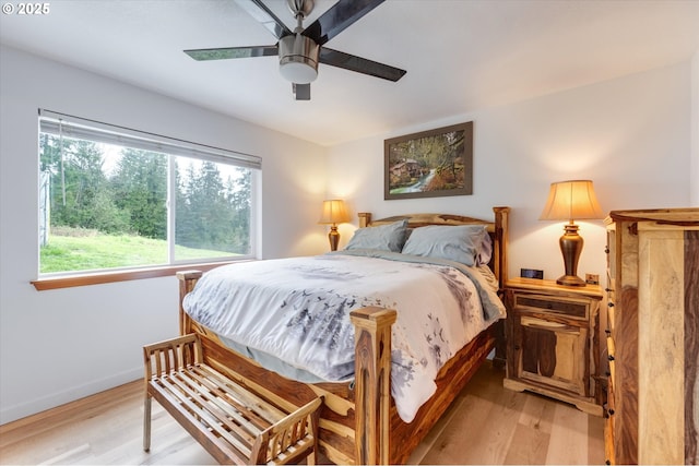 110 Axis Rd, Castle Rock, WA 98611 - bedroom featuring light wood-style flooring, a ceiling fan, and baseboards