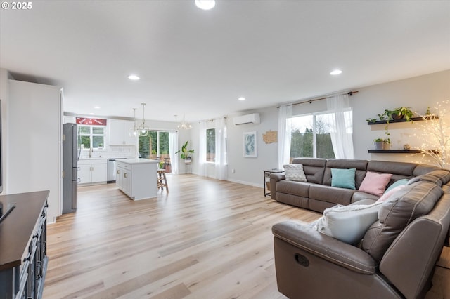 110 Axis Rd, Castle Rock, WA 98611 - living room with a wall mounted AC, recessed lighting, light wood finished floors, and a chandelier