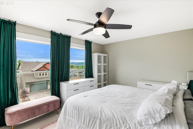 carpeted bedroom featuring ceiling fan